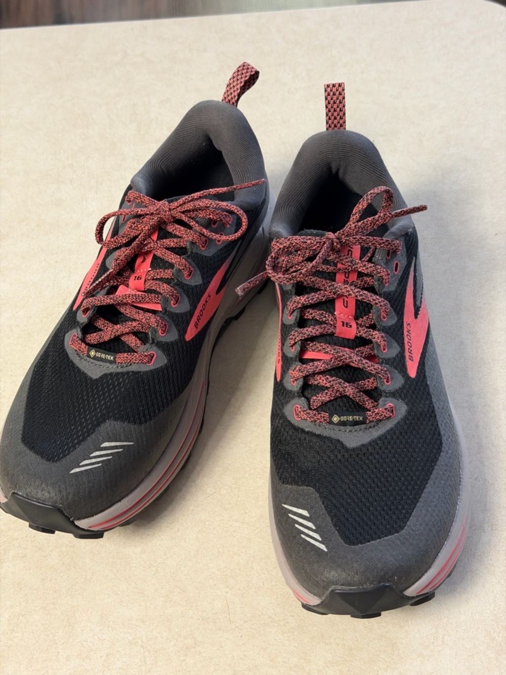 Brooks Black Shoe with Coral and Black Woven Laces